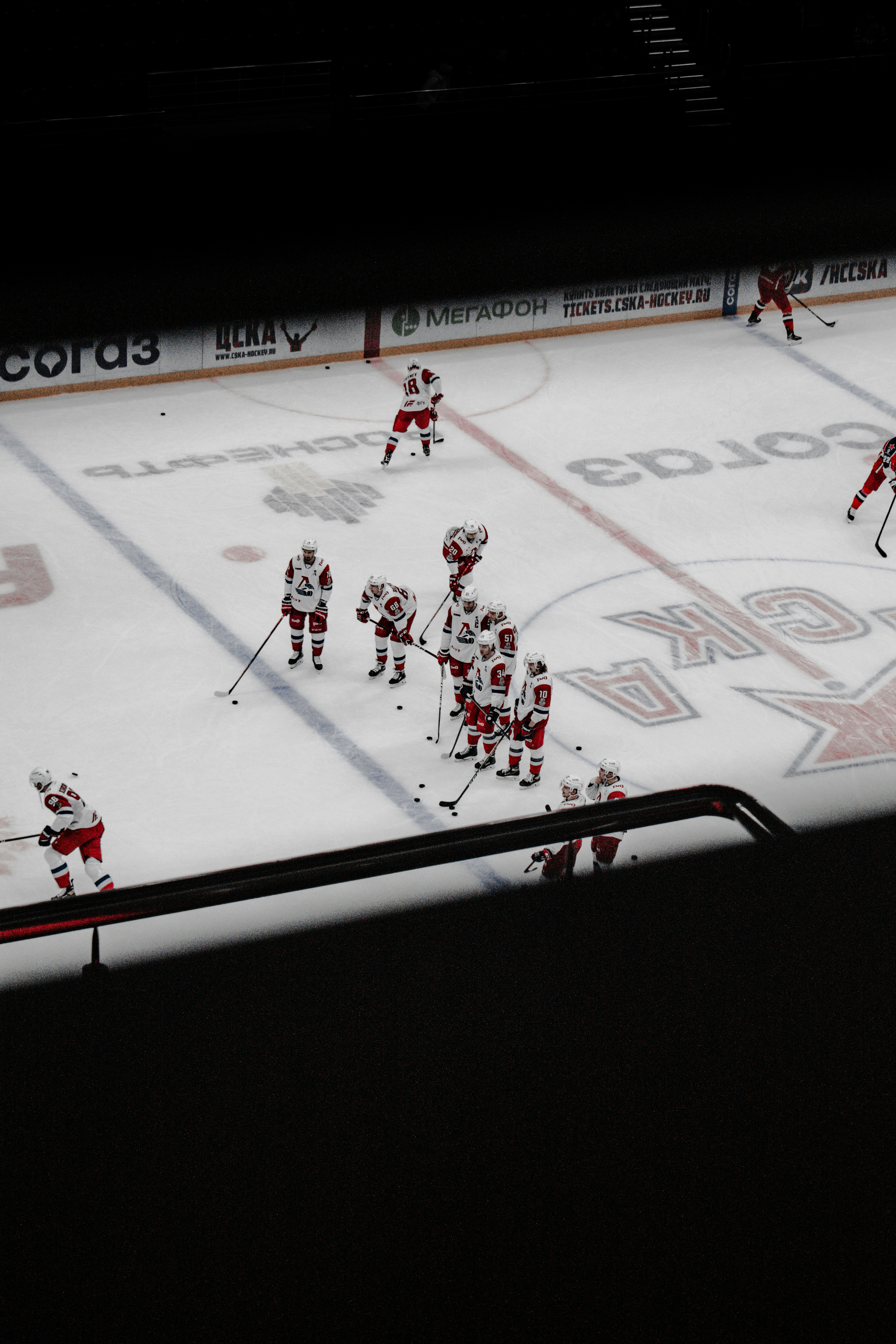 black flat screen tv turned on displaying ice hockey game